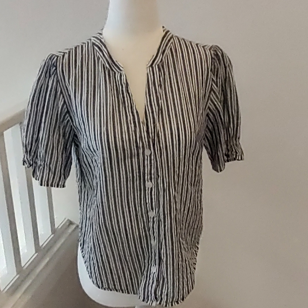 100 percent cotton button down shirt.